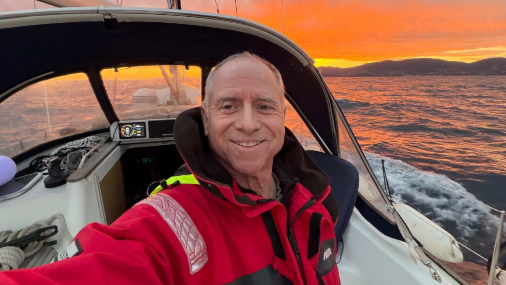 Capt Glenn Shephard takes a selfie against a red sunset