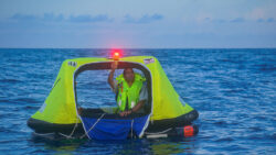 Electronic flare being used from a liferaft as an alternative to traditional pyrotechnic distress signals