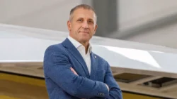 man in suit arm folded