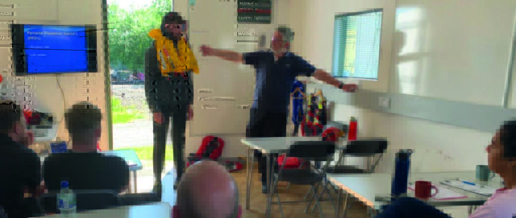 Instructors demonstrate water safety procedures during practical sessions