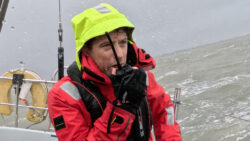 Person at sea on radio