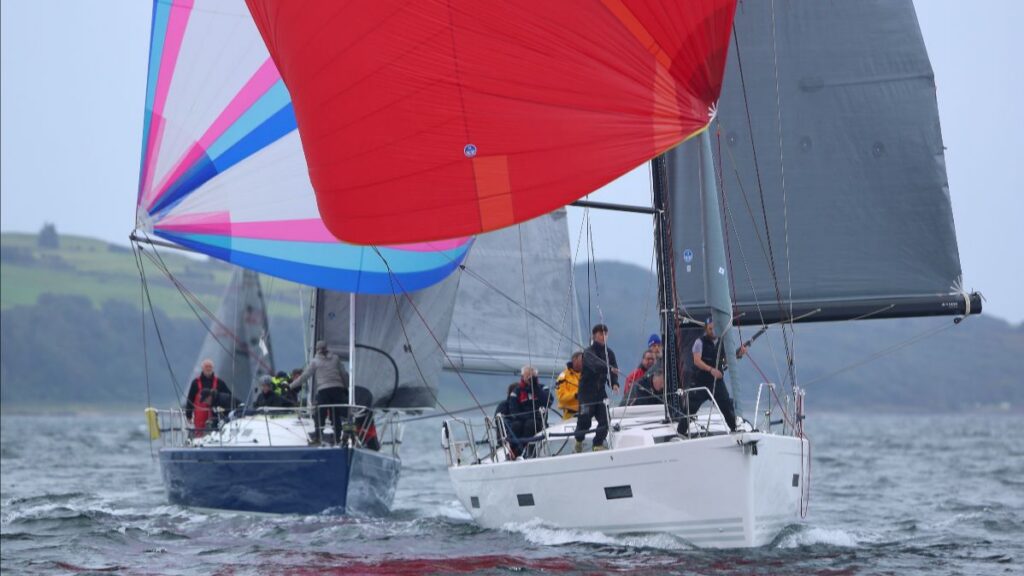 Sailing racing boats with bright sails