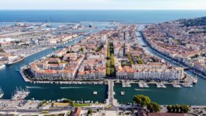 Aerial view of Sète on France's Mediterranean coast, showing its marinas, canals, harbour, and waterfront.