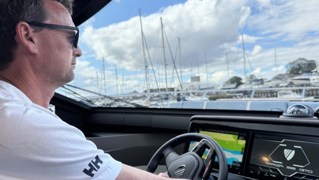 man drives boat