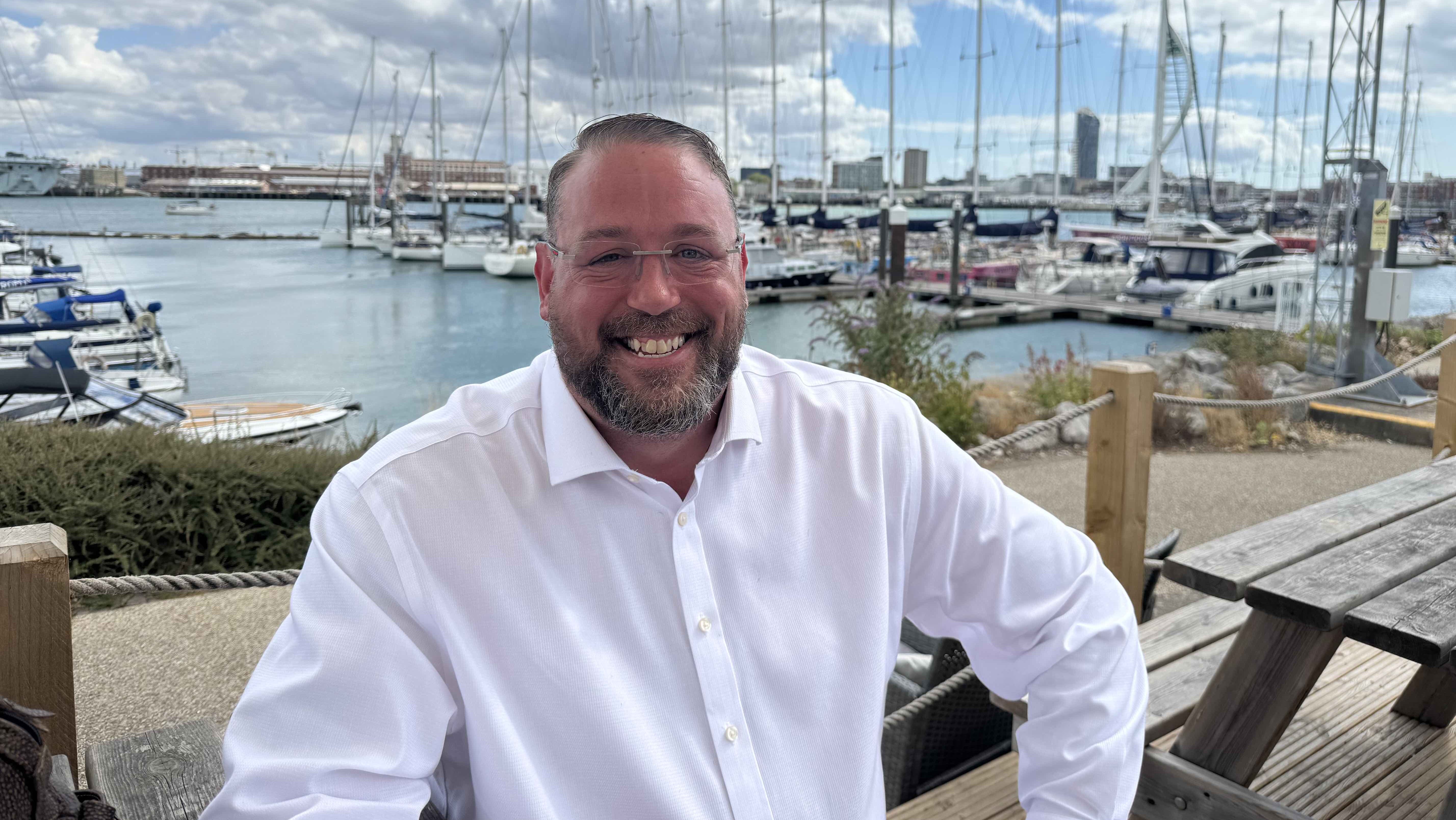 Man in front of Portsmouth Harbour - it's Earle Stanner, CEO of British Marine