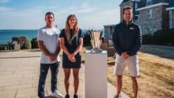 Dylan Fletcher MBE, Jemima Lines and Sir Ben Ainslie with the Louis Vuitton Cup at the Royal Yacht Squadron in Cowes, Isle of Wight