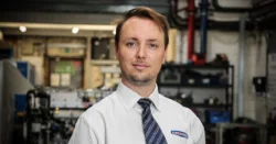 Man in shirt and tie in factory
