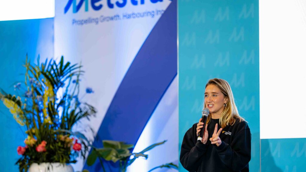 blonde women on conference stage