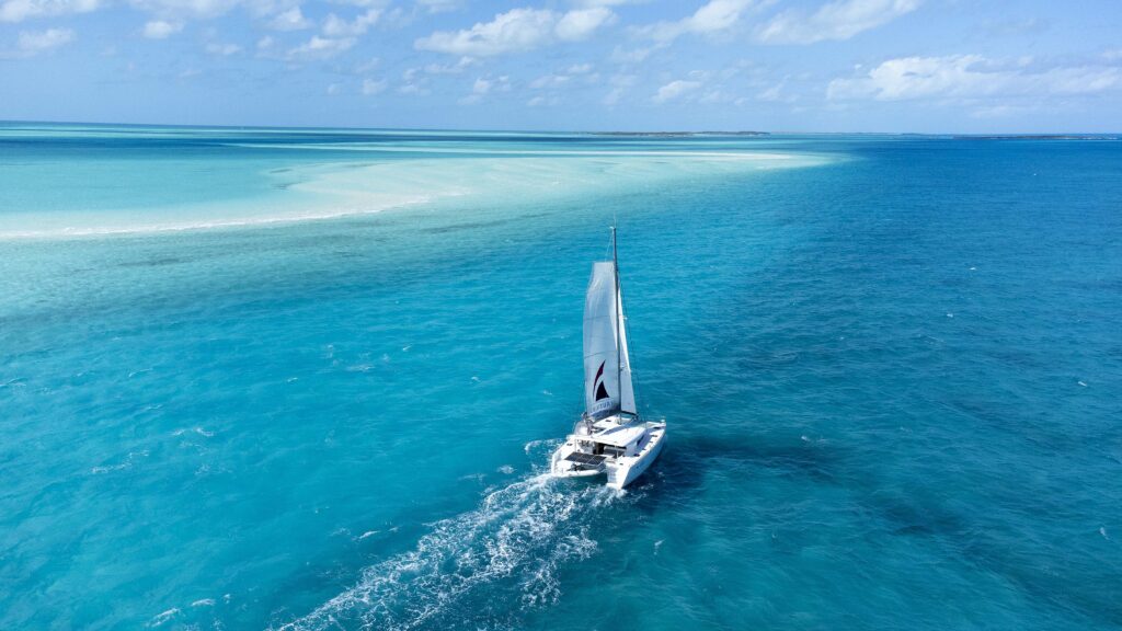 Aerial view of boat on lovely blue sea - it's Nautilus Sailing