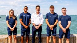 Sir Ben Ainslie with Athena Pathway youth sailors.