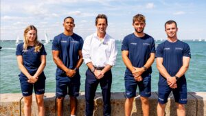 Sir Ben Ainslie with Athena Pathway youth sailors.
