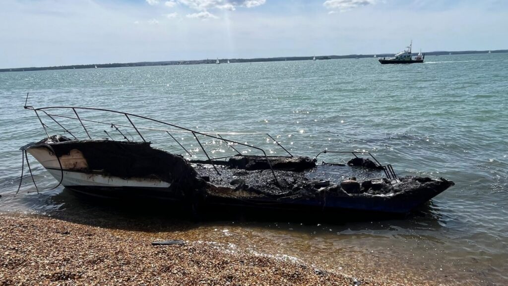 remanents of a boat destroyed by fire