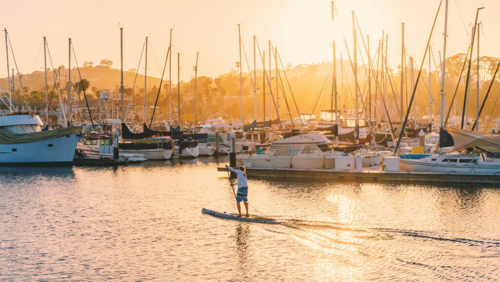 Paddleboarder in UK at sunset
