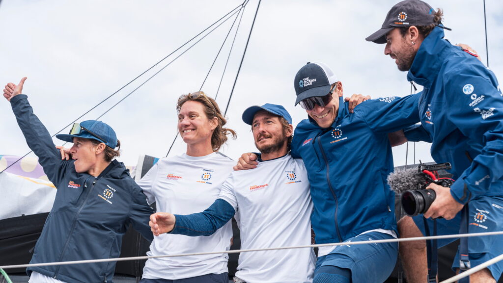 Francesca Clapcich and the 11th Hour Racing crew celebrate on board after finishing second in the Ocean Race Atlantic