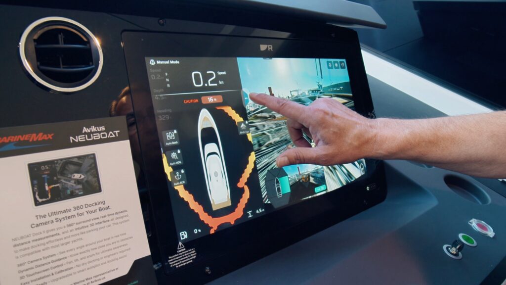 Avikus NEUBOAT dashboard wuth human hand