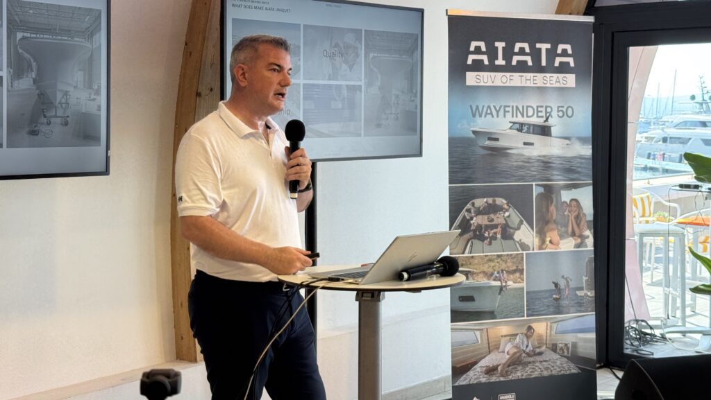 Hakan Kefoğlu (general manager of Anadolu Motor which is developing the boat brand Aiata) - standing with microphone