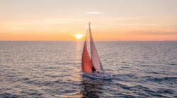 Hallberg Rassy yacht sailing at sunrise