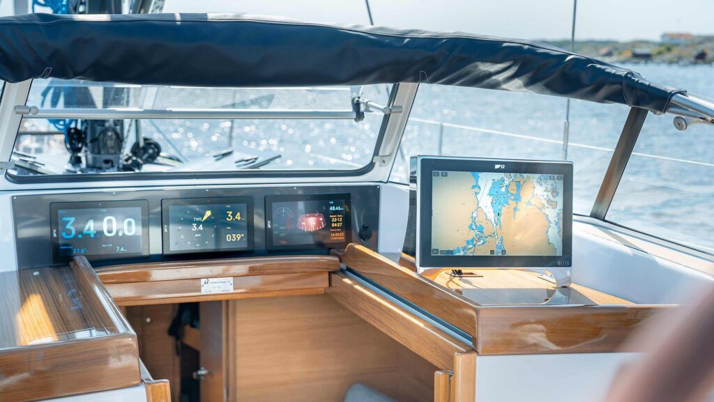 Chartplotter screen and helm on sailing boat