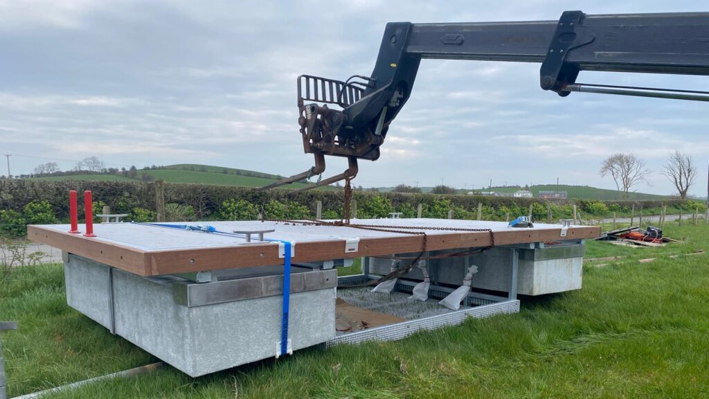 The pontoon being installed via crane