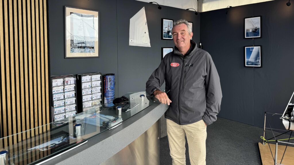 Rob Kemp, Kemp Sails director, standing at his SIBS booth