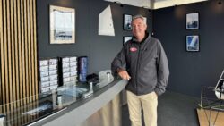 Rob Kemp, Kemp Sails director, standing at his SIBS booth