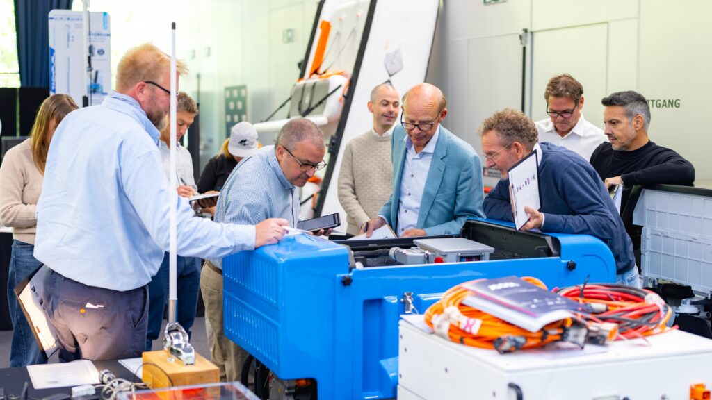People inspecting a product