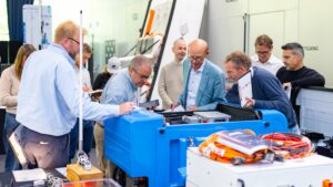 People inspecting a product