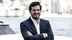 man in suit smiling, marina backdrop