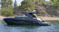 Black speedboat at anchor